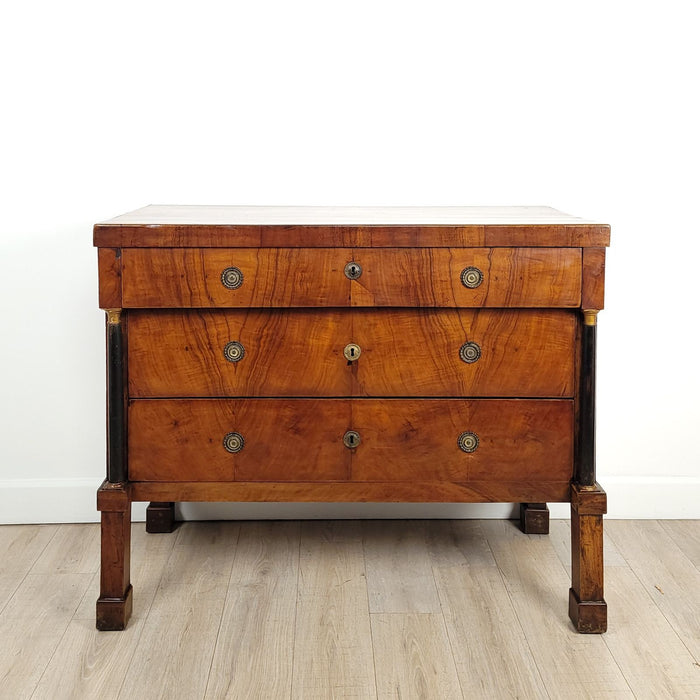 Provincial Walnut Neoclassical Commode with ebonized columns with elegant tall legs. Northern Italy circa 1810